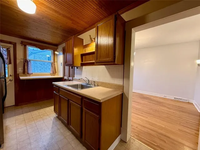 a kitchen with a stove and a microwave