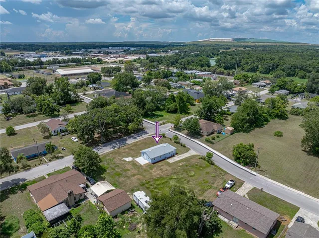 an aerial view of a house with a garden