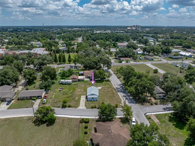 an aerial view of a house with a garden