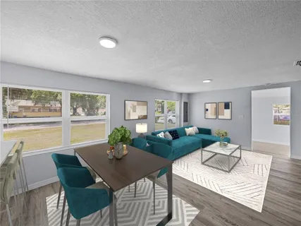 a living room with furniture and a table