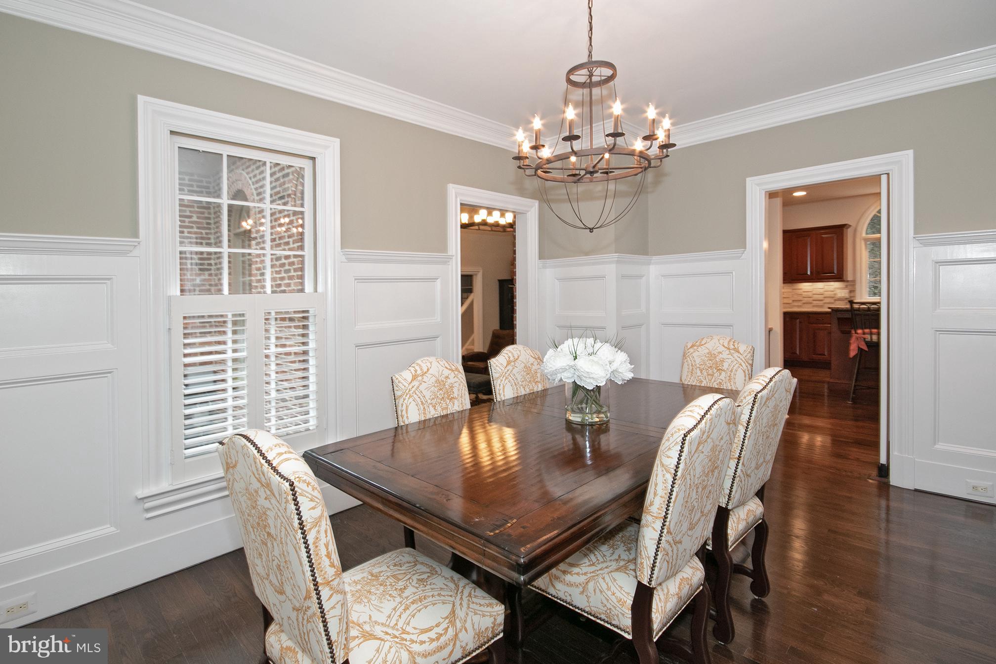 684 Springvale Road Great Falls, VA 22066 - Photo 4 of 27 a view of a dining room with furniture a chandelier and wooden floor