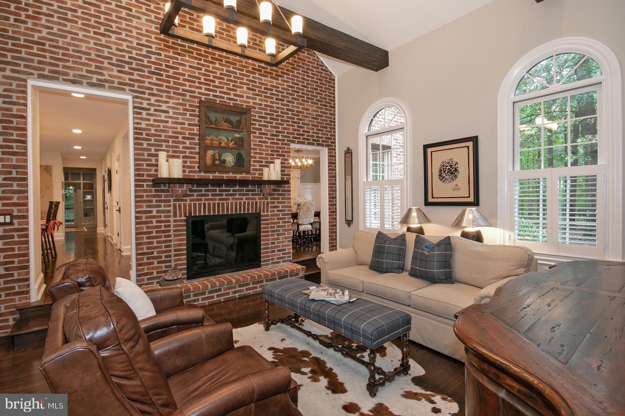 684 Springvale Road Great Falls, VA 22066 - Photo 7 of 27 a living room with furniture fireplace and a large window