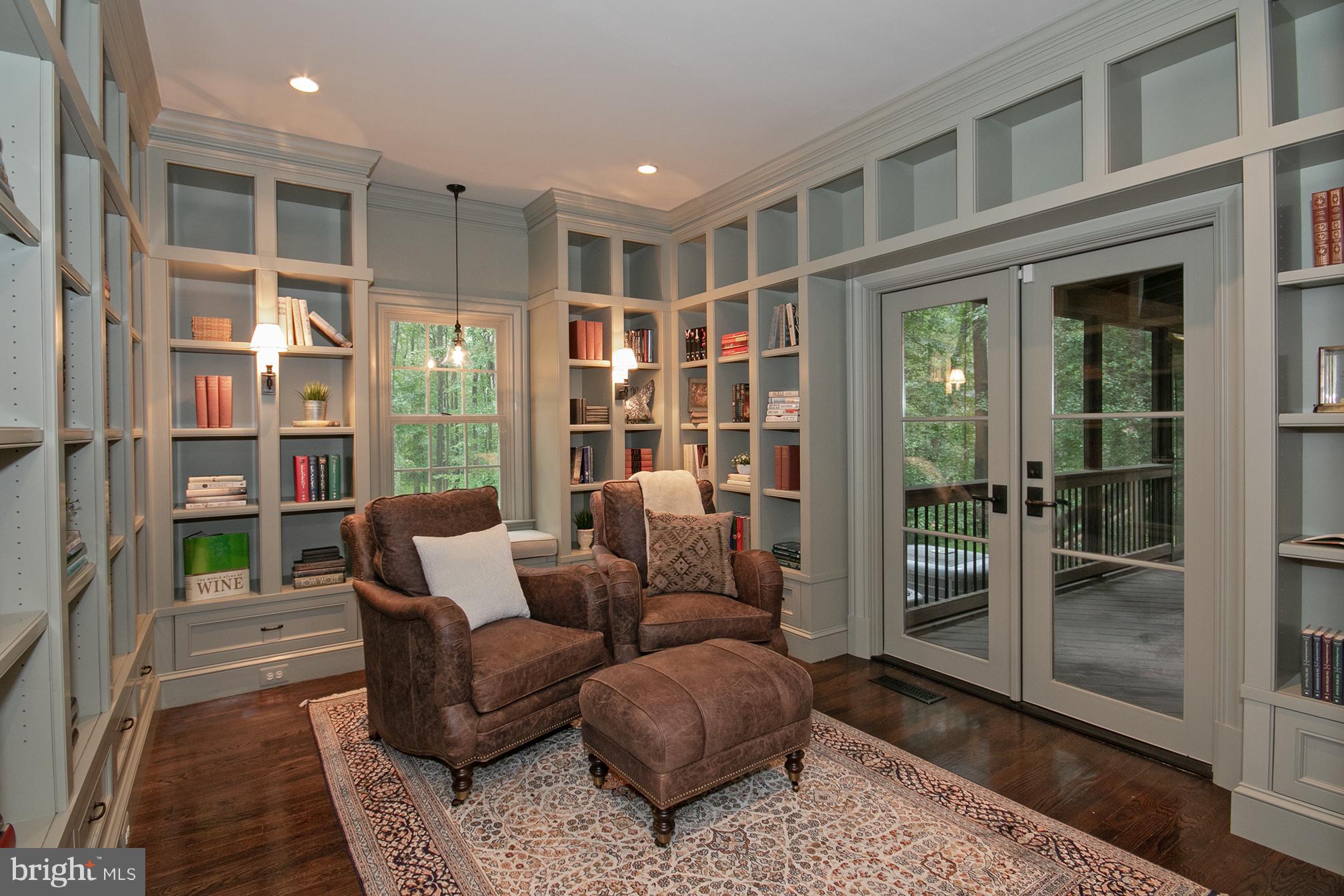 684 Springvale Road Great Falls, VA 22066 - Photo 8 of 27 a living room with furniture a rug and a large window