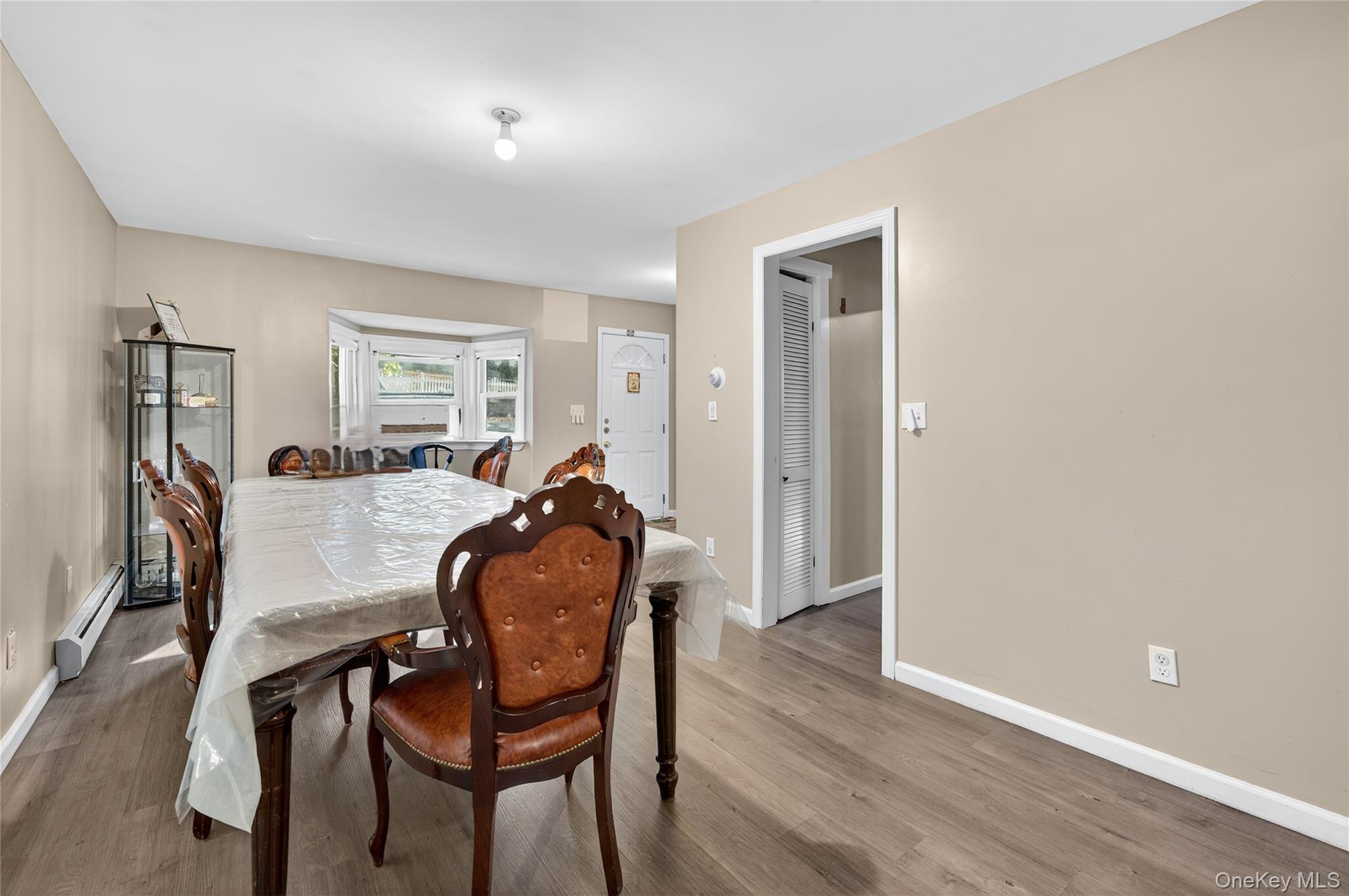 469 Hillside Road Monroe, NY 10950 - Photo 12 of 44 Dining room with wood finished floors and a baseboard radiator