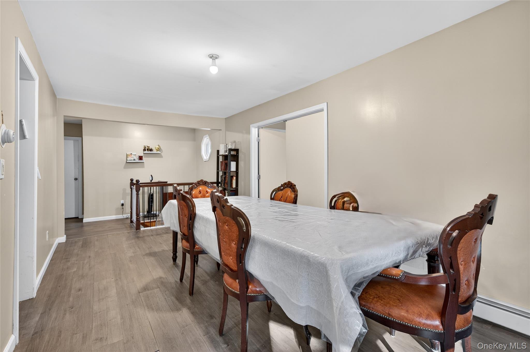 469 Hillside Road Monroe, NY 10950 - Photo 13 of 44 Dining room featuring wood finished floors and baseboard heating