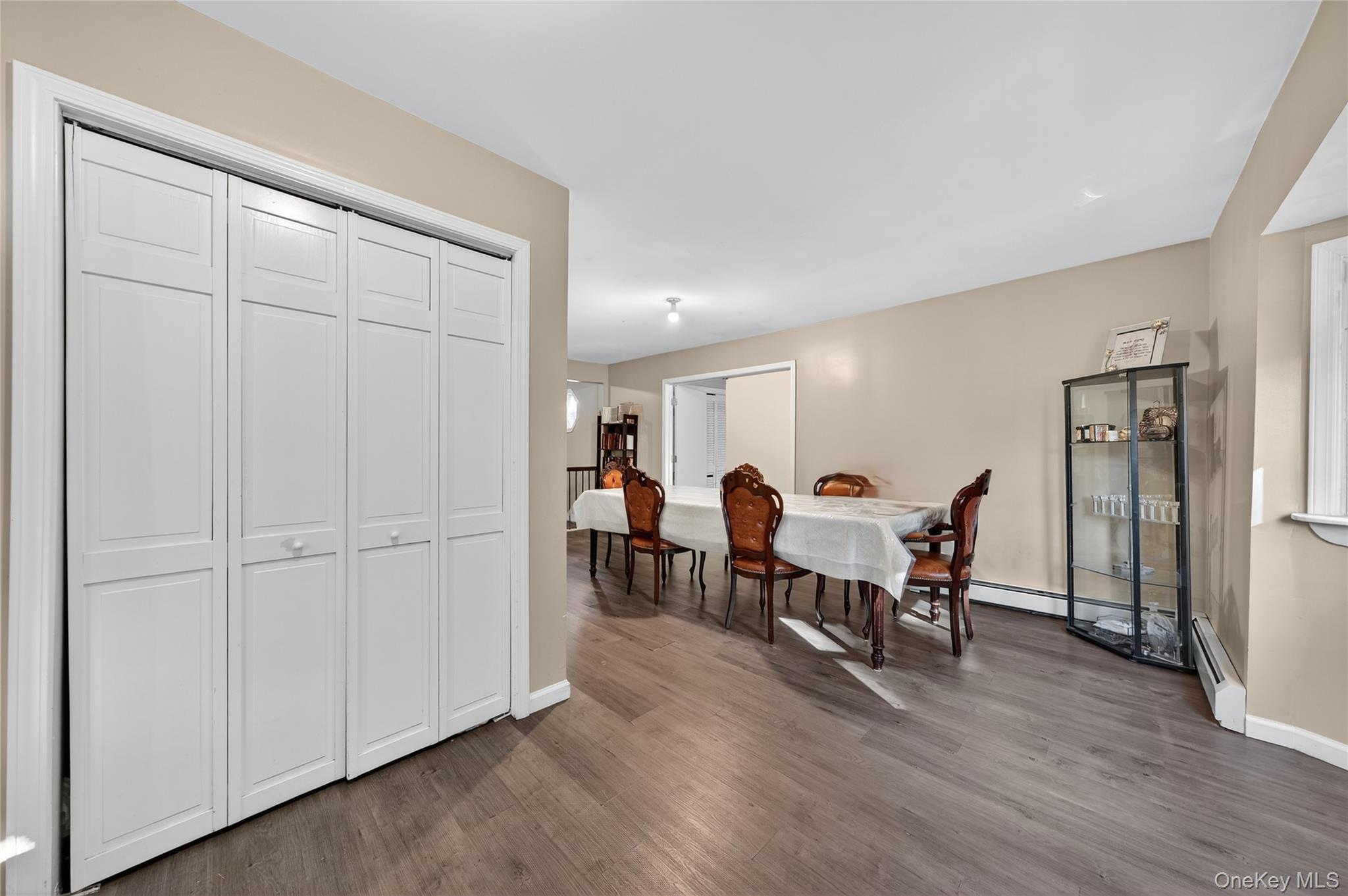 469 Hillside Road Monroe, NY 10950 - Photo 15 of 44 a view of a dining area with furniture and wooden floor