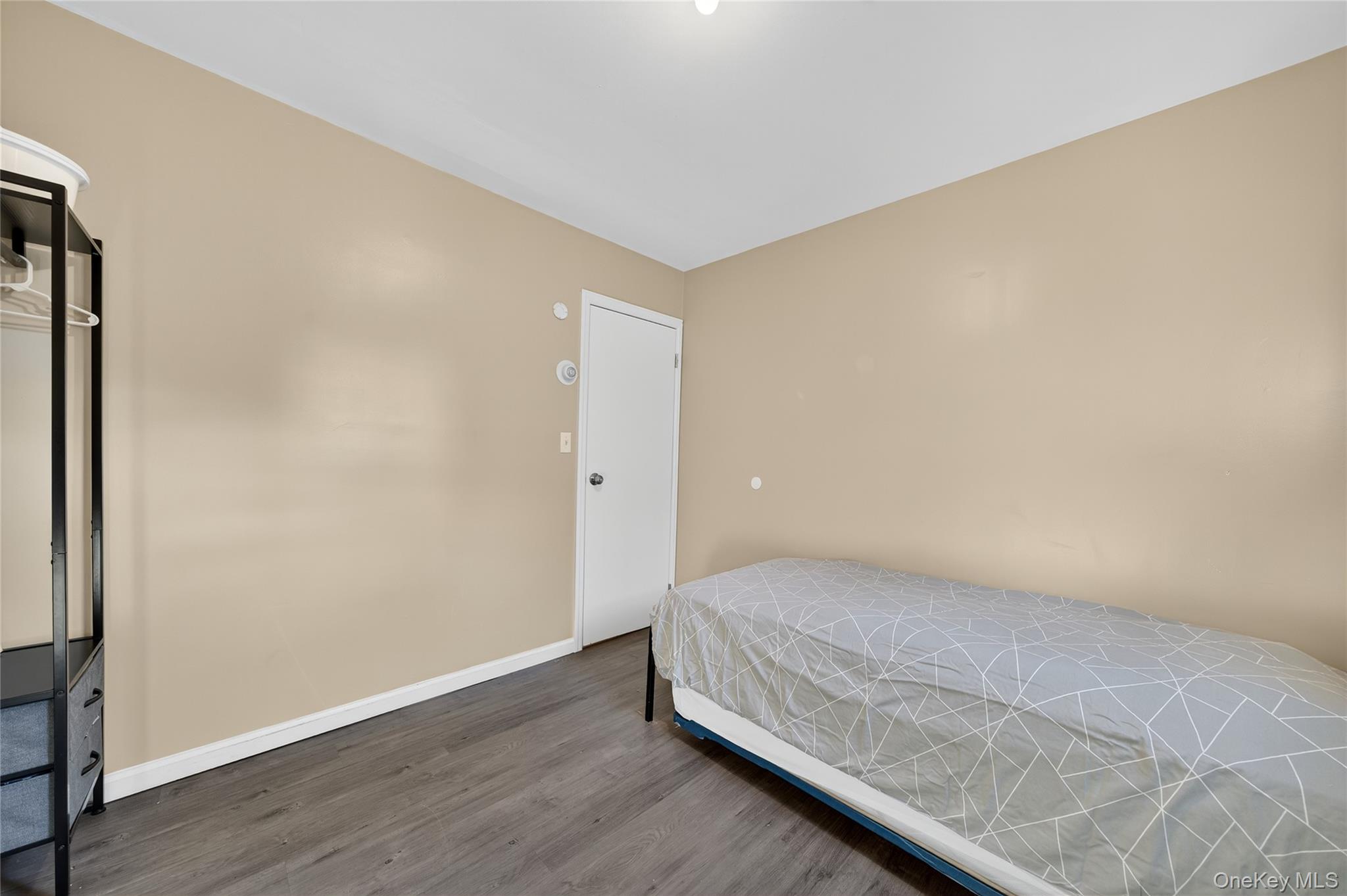 469 Hillside Road Monroe, NY 10950 - Photo 19 of 44 a bedroom with a bed and wooden floor