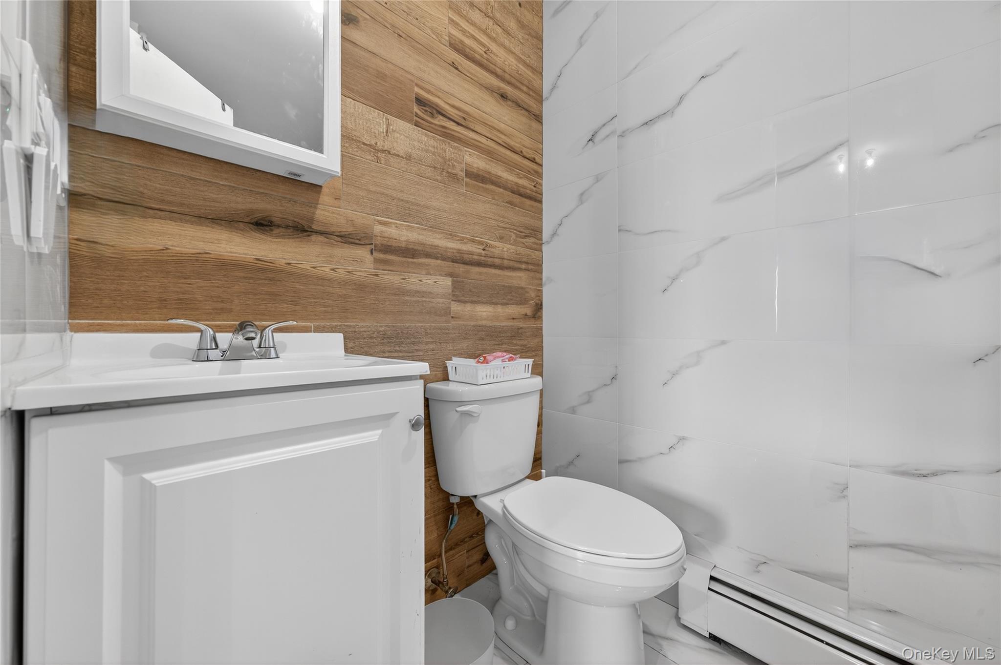 469 Hillside Road Monroe, NY 10950 - Photo 23 of 44 a bathroom with a sink a toilet and a mirror