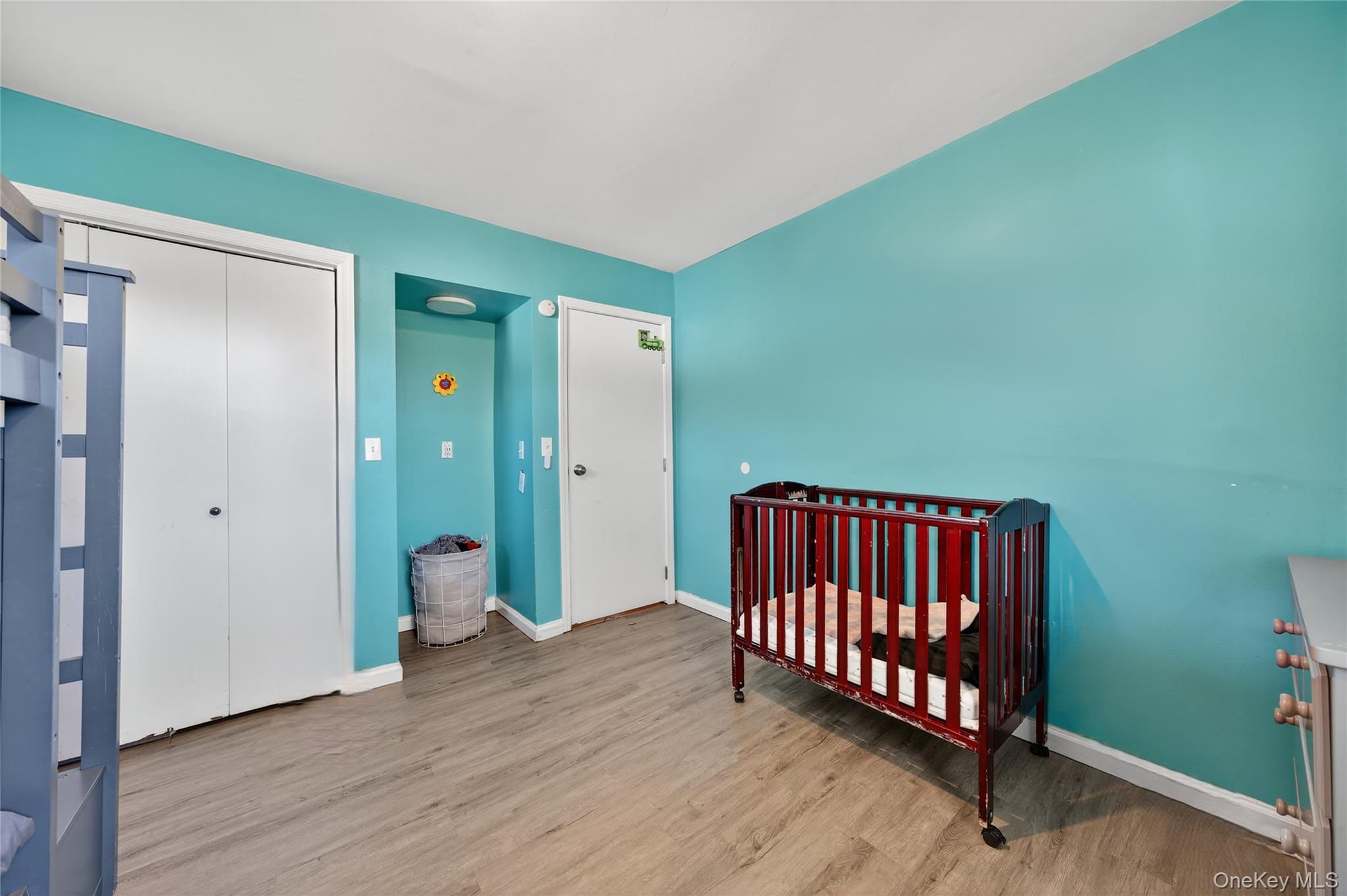 469 Hillside Road Monroe, NY 10950 - Photo 26 of 44 a view of a room with wooden floor and windows