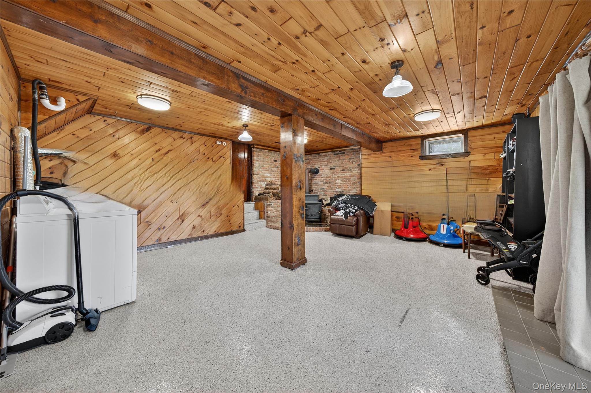 469 Hillside Road Monroe, NY 10950 - Photo 29 of 44 Below grade area featuring wooden walls, washer and dryer, and wooden ceiling