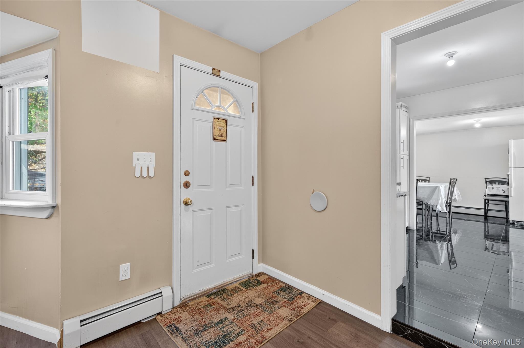 469 Hillside Road Monroe, NY 10950 - Photo 3 of 44 Entryway with a baseboard radiator and dark wood-style floors