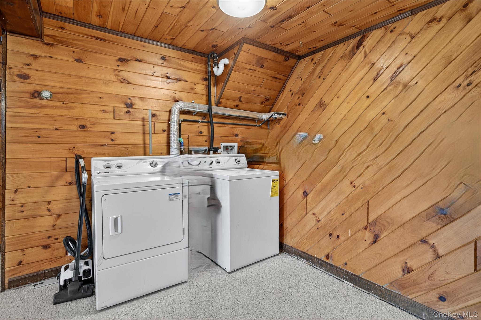 469 Hillside Road Monroe, NY 10950 - Photo 31 of 44 Laundry room with wood walls, wood ceiling, and washing machine and clothes dryer