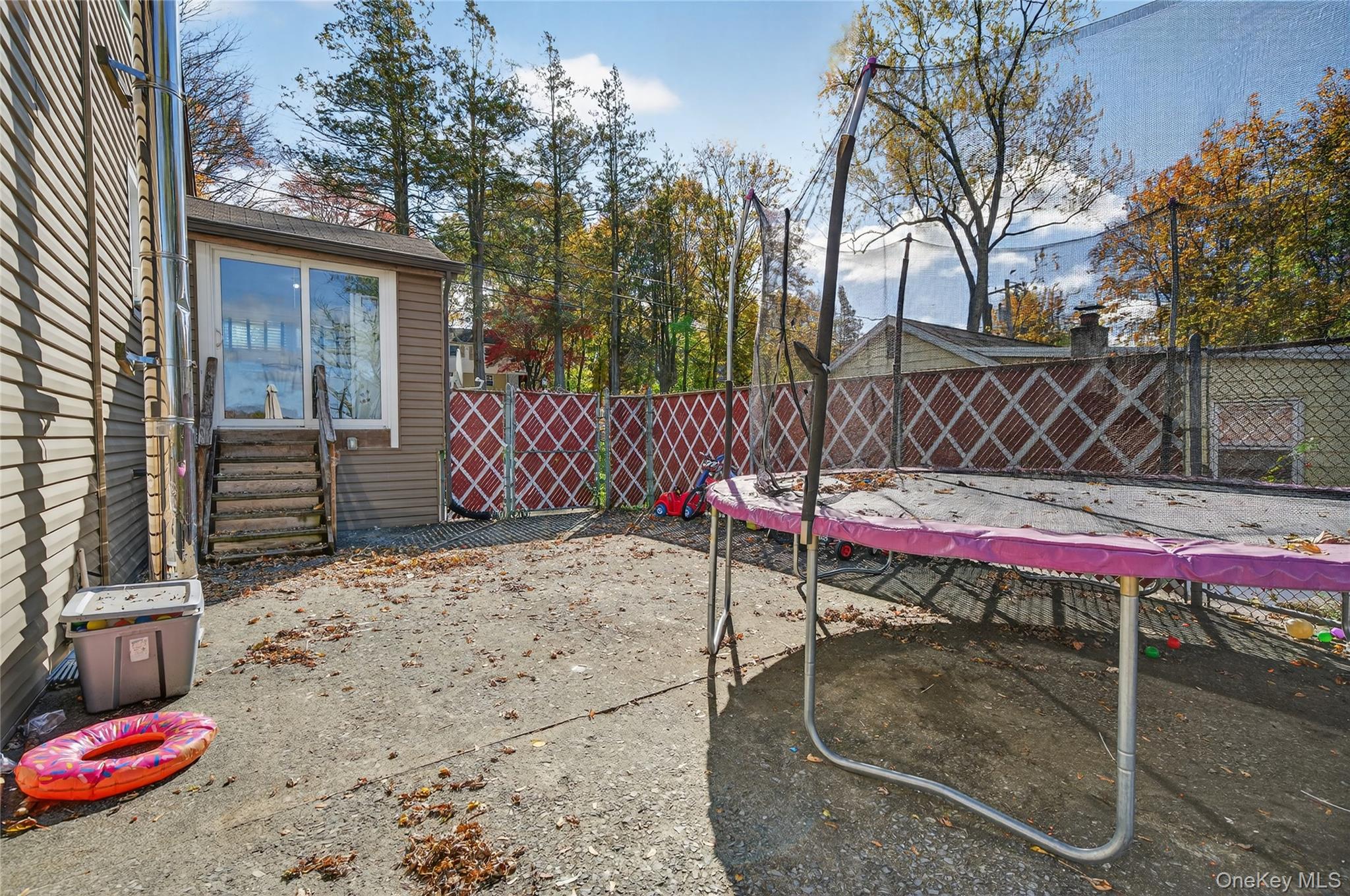 469 Hillside Road Monroe, NY 10950 - Photo 38 of 44 Fenced backyard featuring a trampoline and a patio area