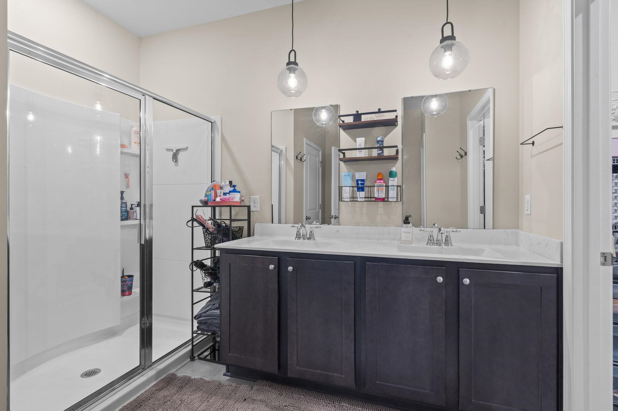 2605 Muhly Court Conway, SC 29526 - Photo 11 of 33 Full bathroom featuring double vanity and a shower stall