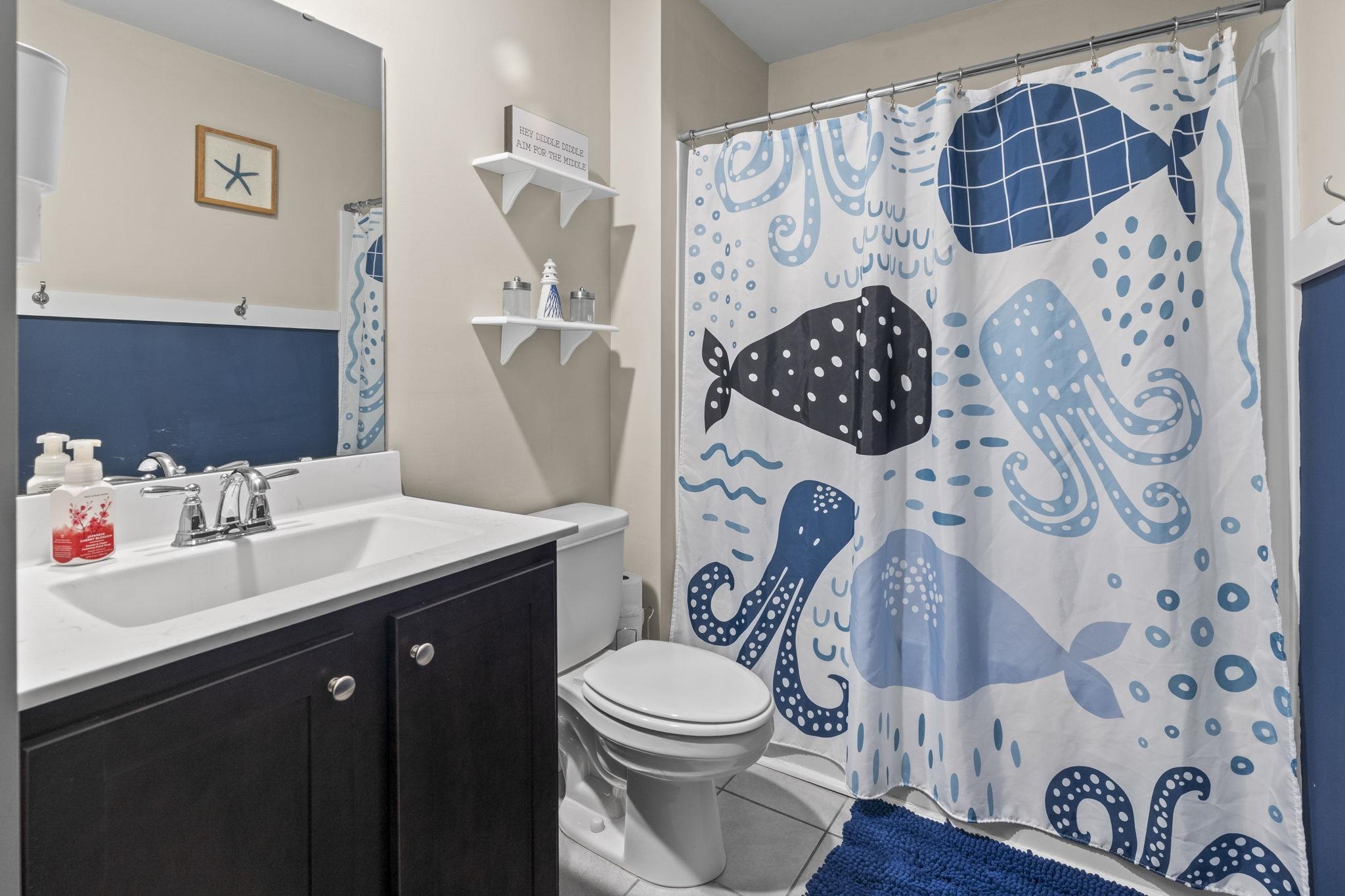 2605 Muhly Court Conway, SC 29526 - Photo 13 of 33 Full bathroom featuring vanity, a shower with curtain, and tile patterned floors