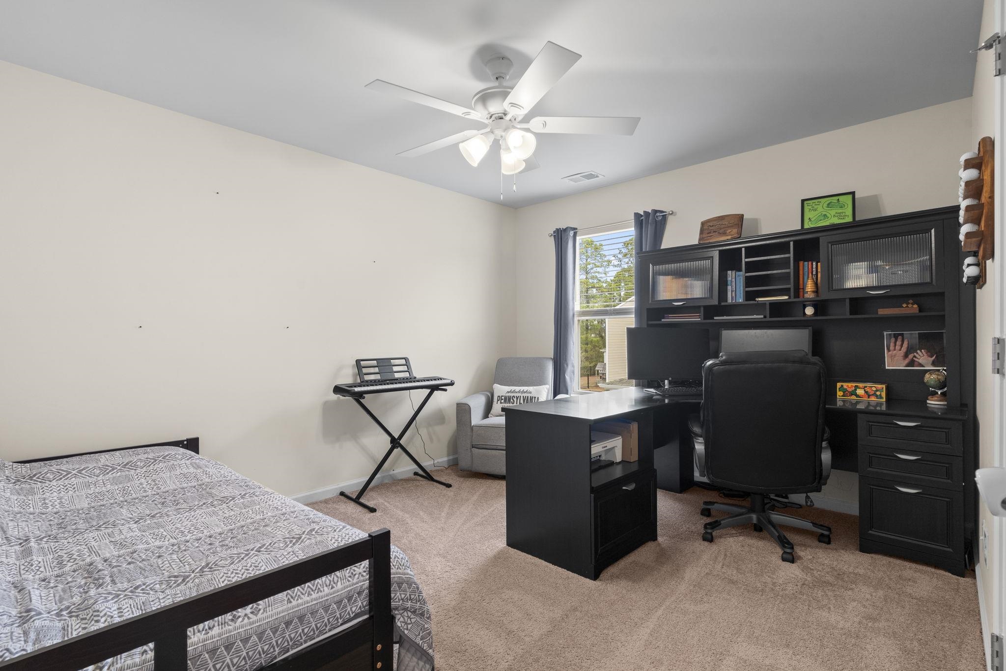 2605 Muhly Court Conway, SC 29526 - Photo 19 of 33 Bedroom featuring light colored carpet, an office area, and ceiling fan
