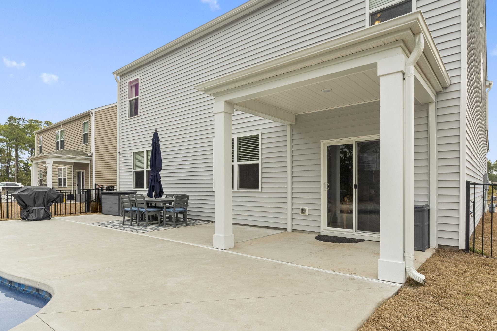 2605 Muhly Court Conway, SC 29526 - Photo 20 of 33 Back of house with a patio and outdoor dining area