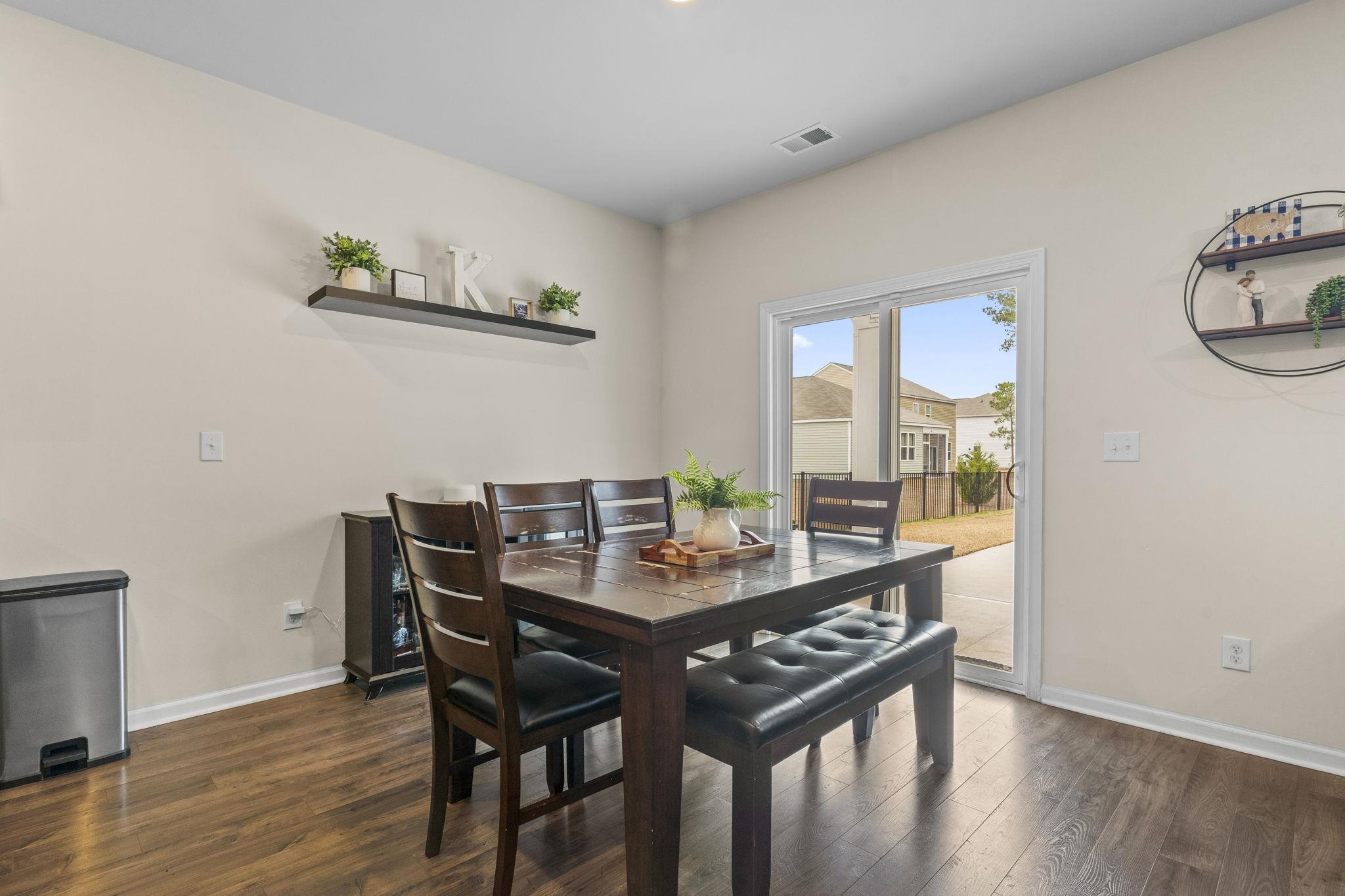 2605 Muhly Court Conway, SC 29526 - Photo 8 of 33 Dining room featuring dark wood-style floors and baseboards