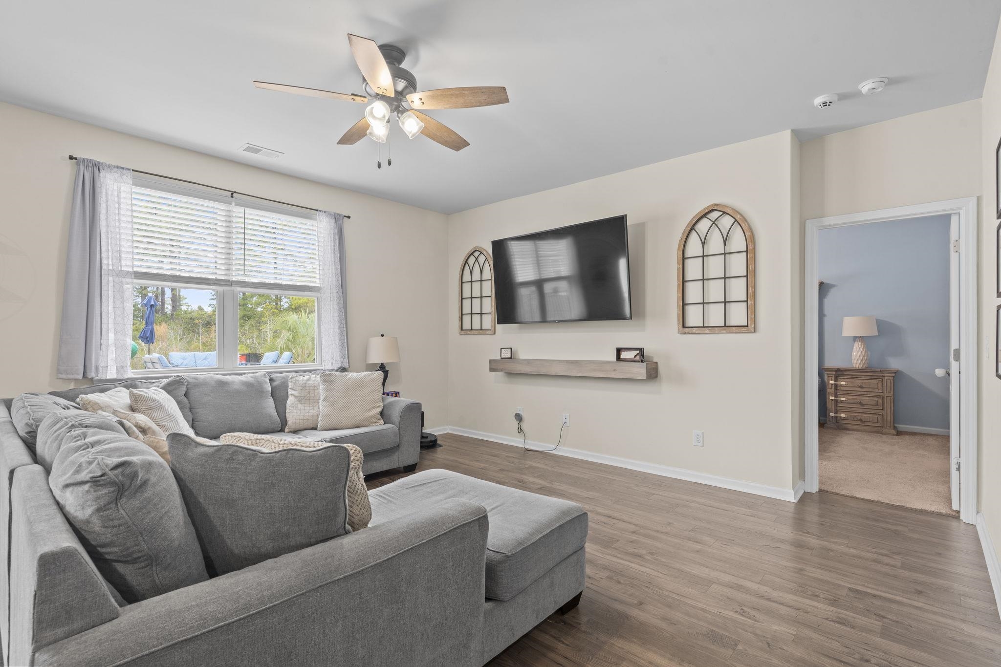 2605 Muhly Court Conway, SC 29526 - Photo 9 of 33 Living room featuring wood finished floors and ceiling fan