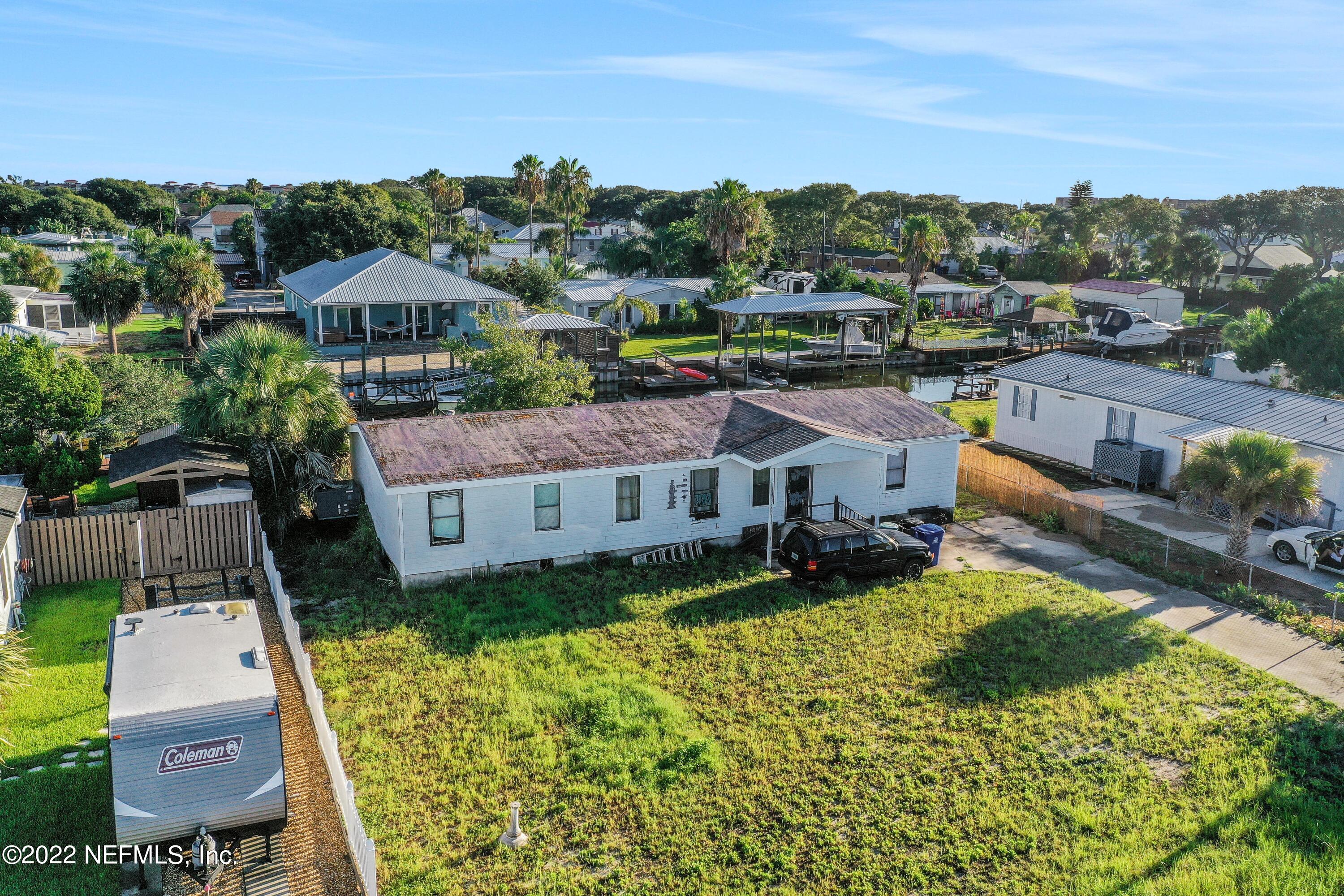 228 Treasure Beach Road St. Augustine, FL 32080 - Photo 1 of 15 a aerial view of a house with a big yard