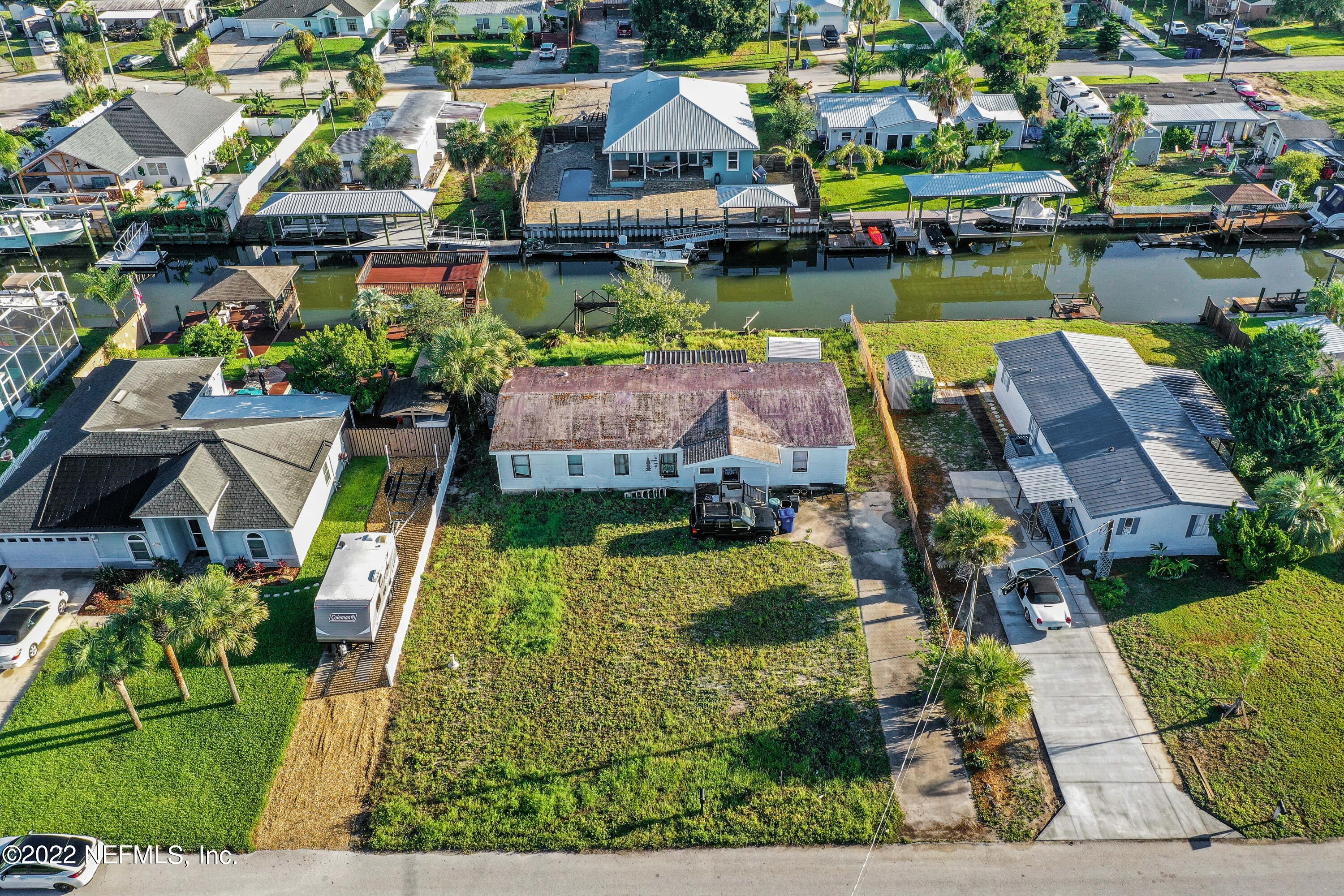 228 Treasure Beach Road St. Augustine, FL 32080 - Photo 3 of 15 an aerial view of residential houses with outdoor space and lake view