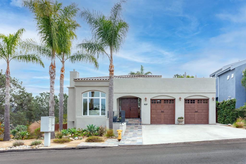 527 Liverpool Drive Cardiff-by-the-Sea, CA 92007 - Photo 1 of 12 a front view of a house with yard and parking