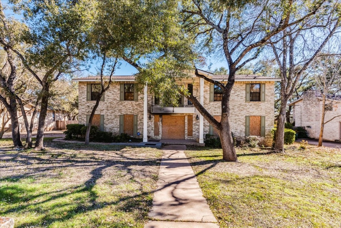 a view of a house with snow on the road