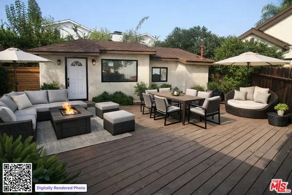 a view of a patio with couches table and chairs and potted plants