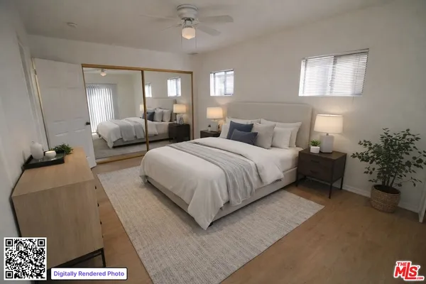 a bedroom with a bed and a couch