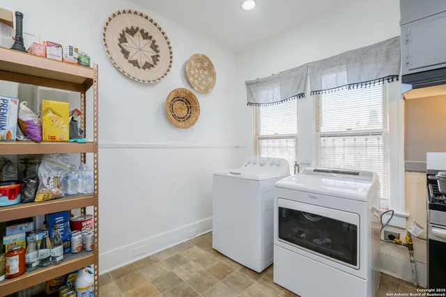 a view of a kitchen with washer and dryer