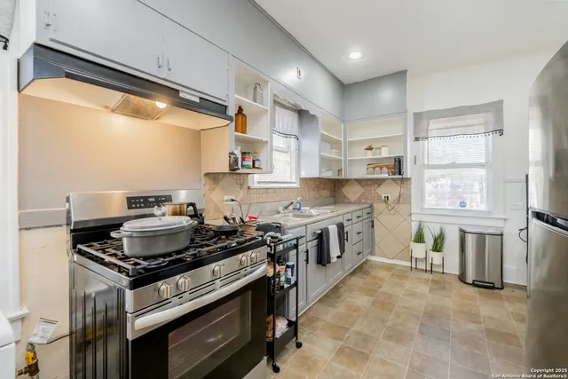 a kitchen with a stove and a sink