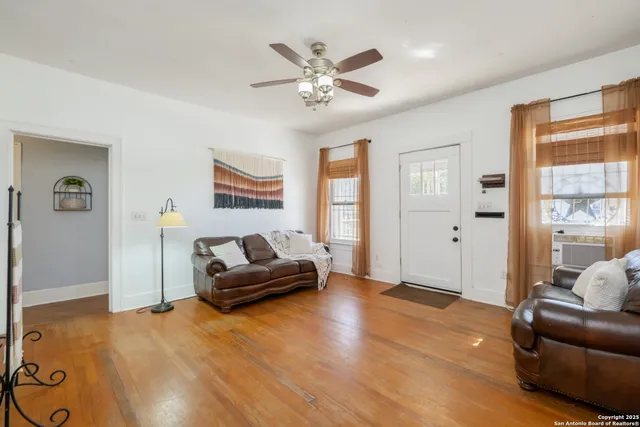 a living room with furniture and window
