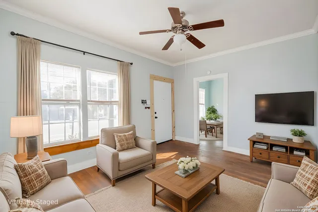 a living room with furniture and a flat screen tv