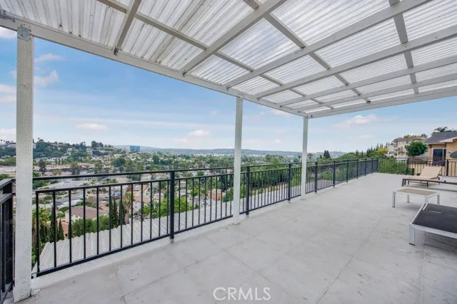 a view of a city skyline from a balcony