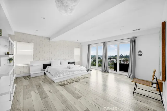 a living room with furniture and large window