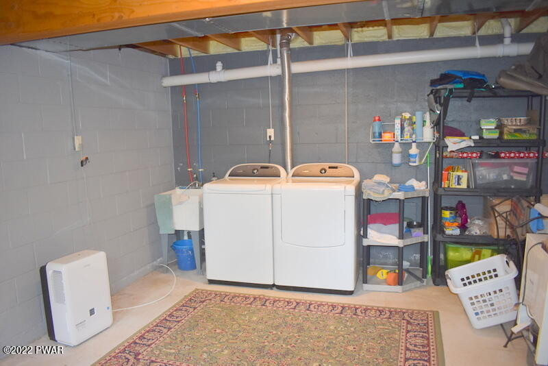549 Finn Swamp Road Lakeville, PA 18438 - Photo 21 of 35 a utility room with dryer and washer