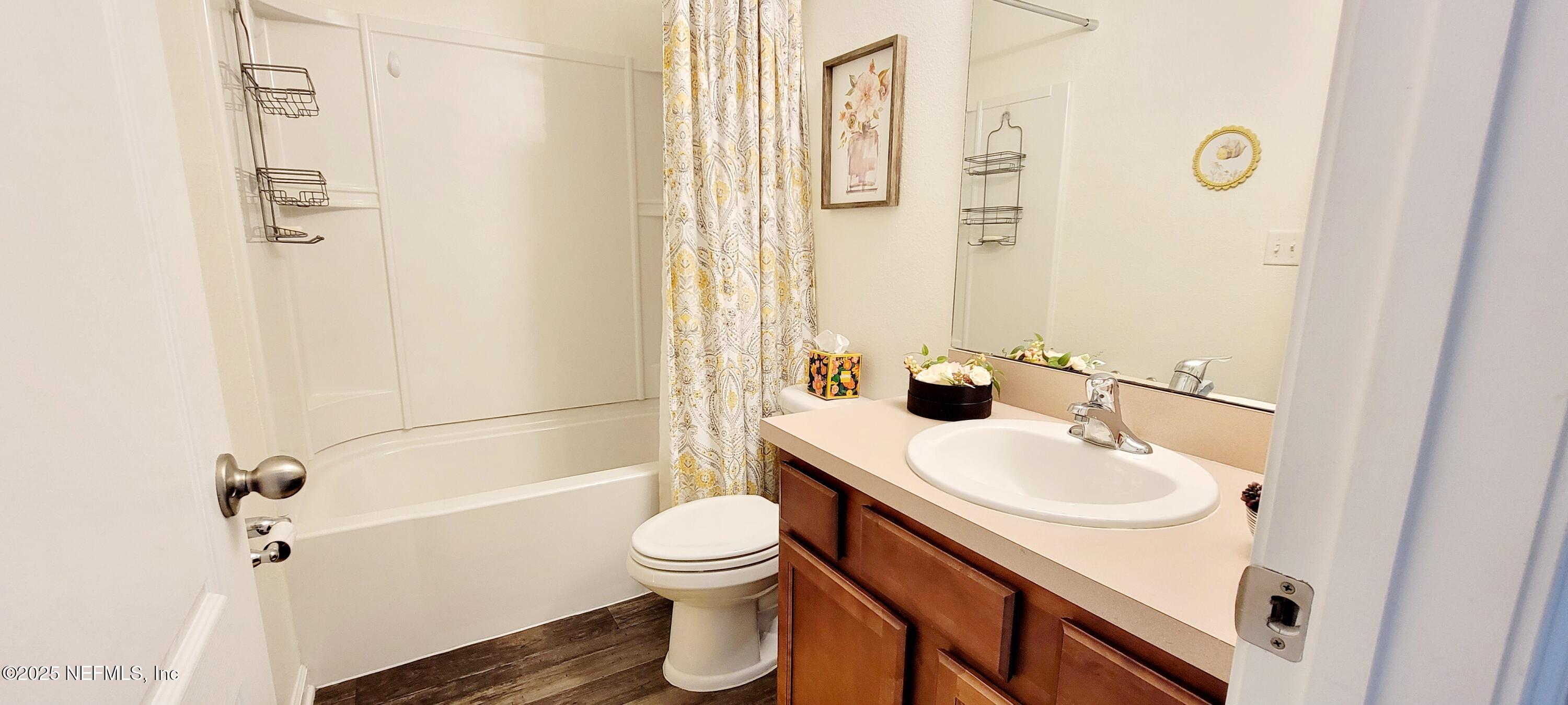 82 Whitland Way St. Augustine, FL 32086 - Photo 12 of 24 a bathroom with a sink toilet and shower