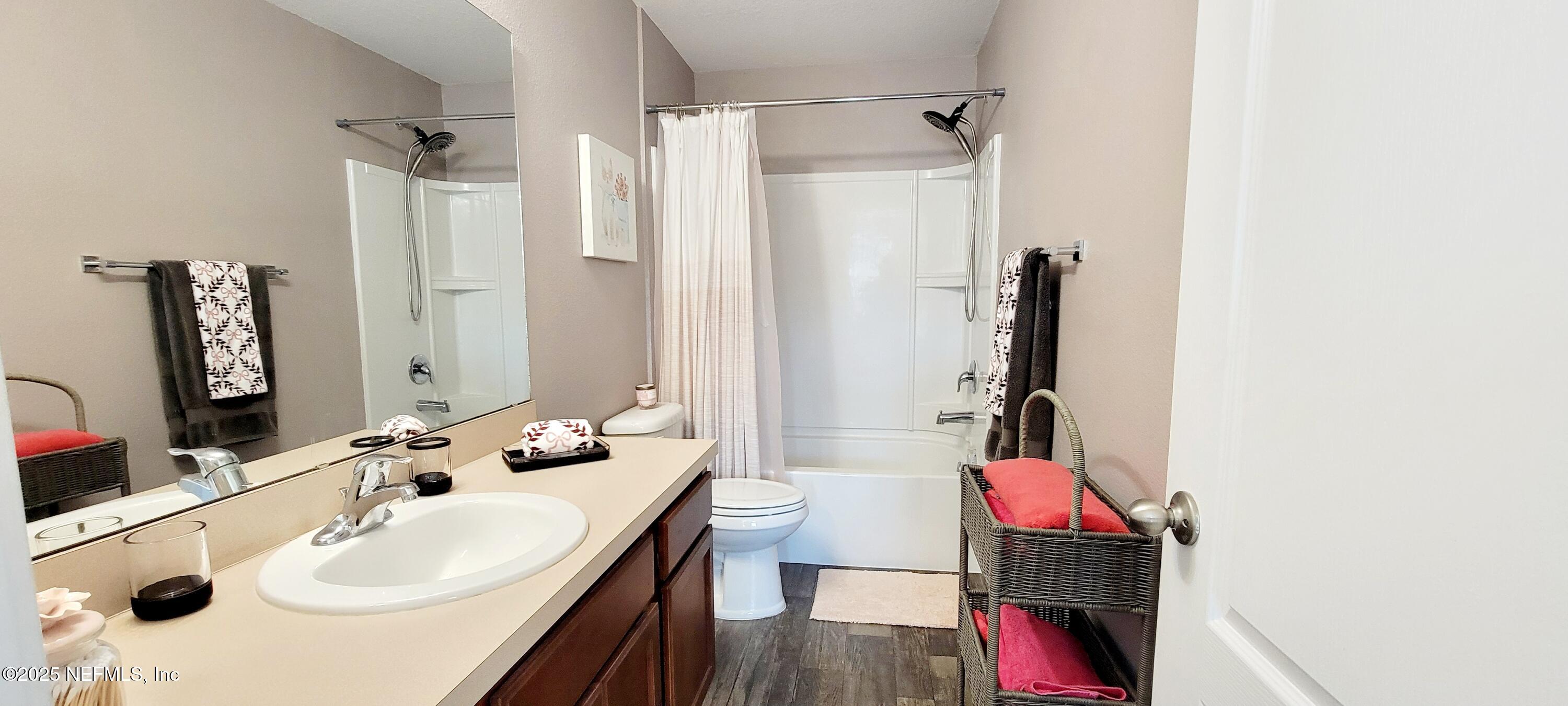 82 Whitland Way St. Augustine, FL 32086 - Photo 18 of 24 a bathroom with a sink and a mirror