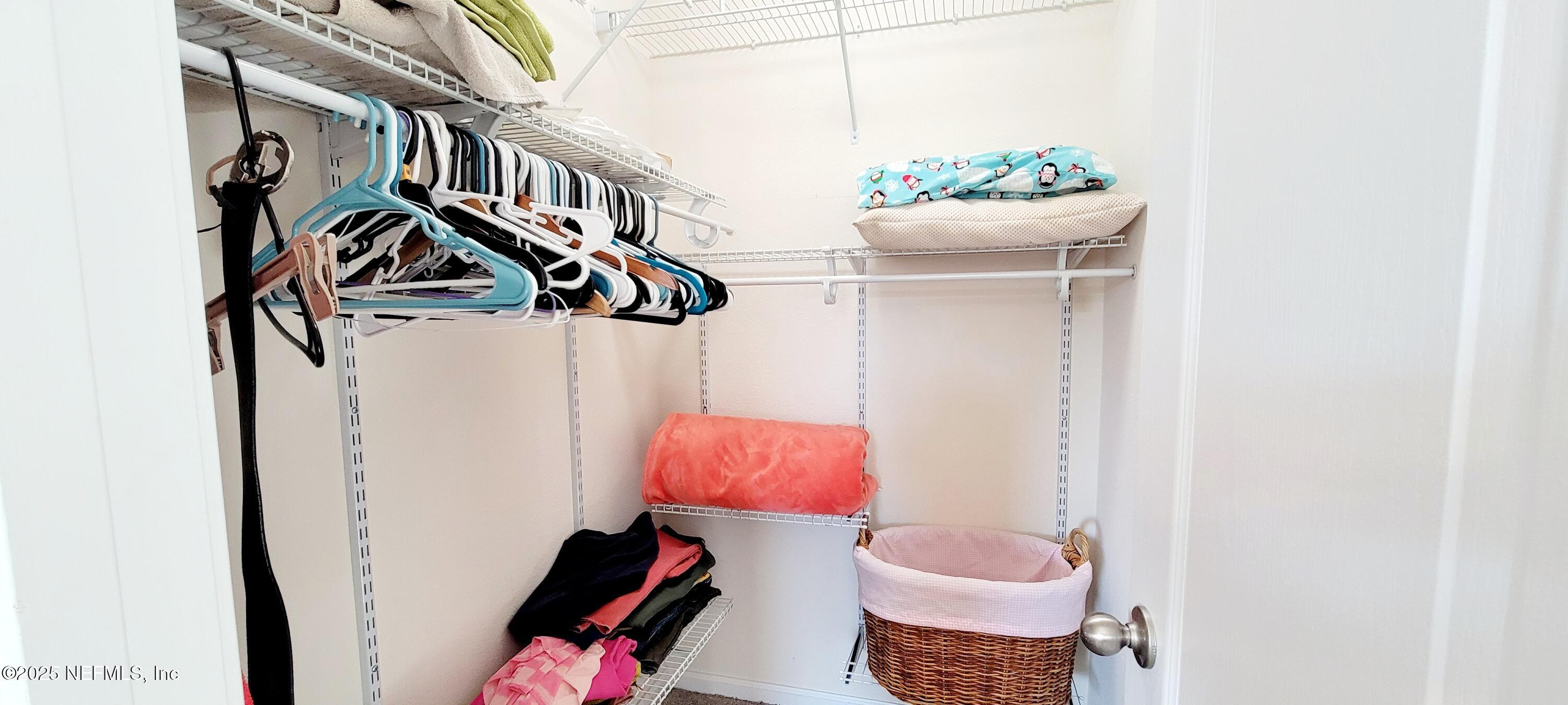 82 Whitland Way St. Augustine, FL 32086 - Photo 24 of 24 a living room with a couch and a potted plant