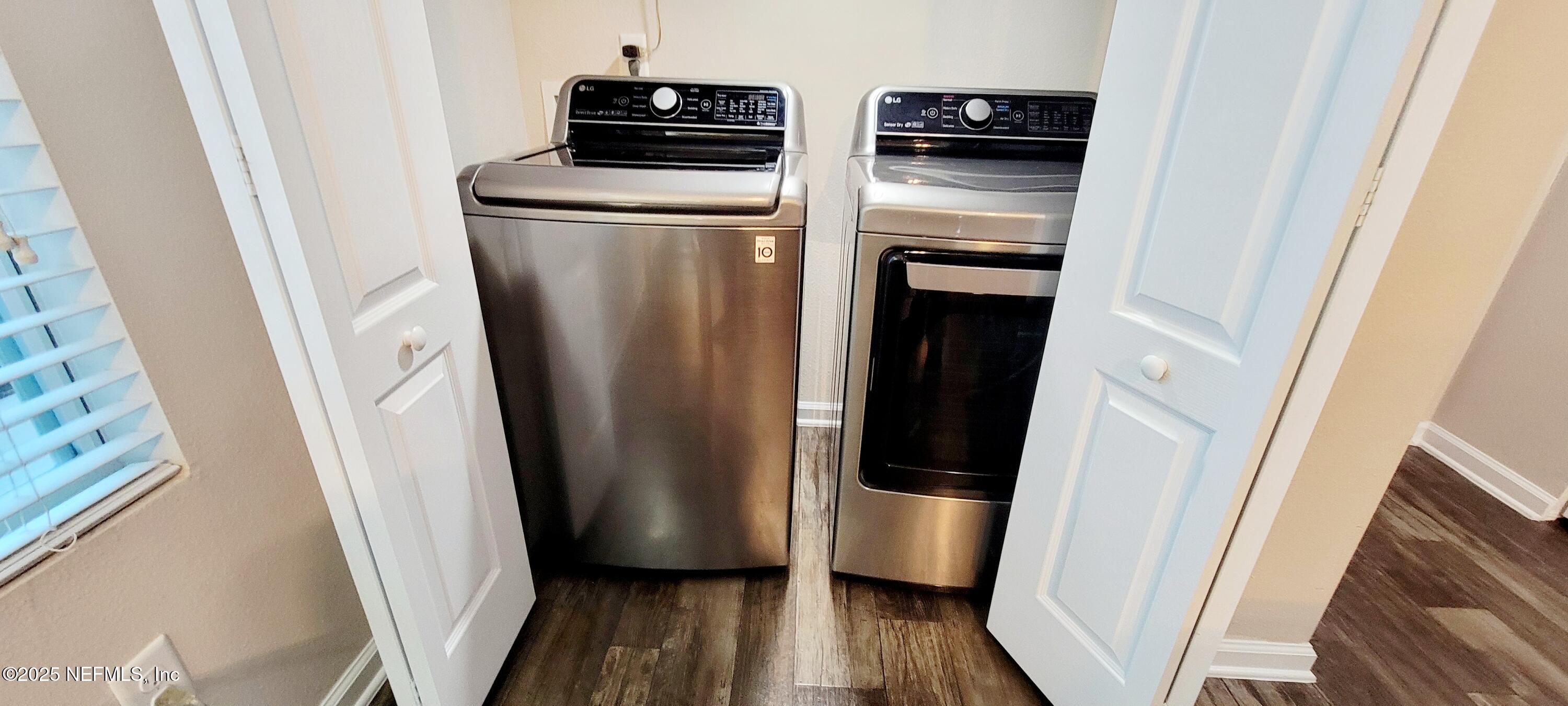 82 Whitland Way St. Augustine, FL 32086 - Photo 9 of 24 a kitchen with a refrigerator and wooden floor