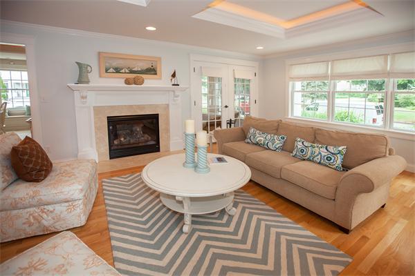 20 Grasshopper Lane Scituate, MA 02066 - Photo 17 of 30 a living room with furniture and a fireplace