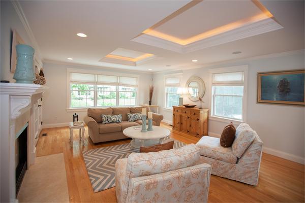 20 Grasshopper Lane Scituate, MA 02066 - Photo 18 of 30 a living room with furniture a fireplace and a large window