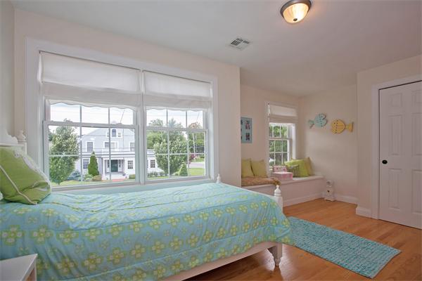 20 Grasshopper Lane Scituate, MA 02066 - Photo 23 of 30 a bedroom with a bed and wooden floor