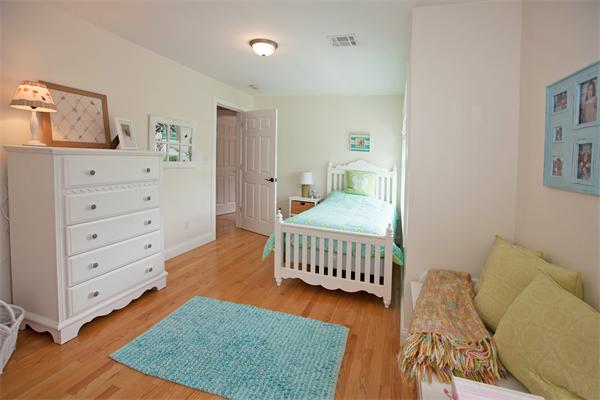20 Grasshopper Lane Scituate, MA 02066 - Photo 24 of 30 a bedroom with furniture and a baby crib