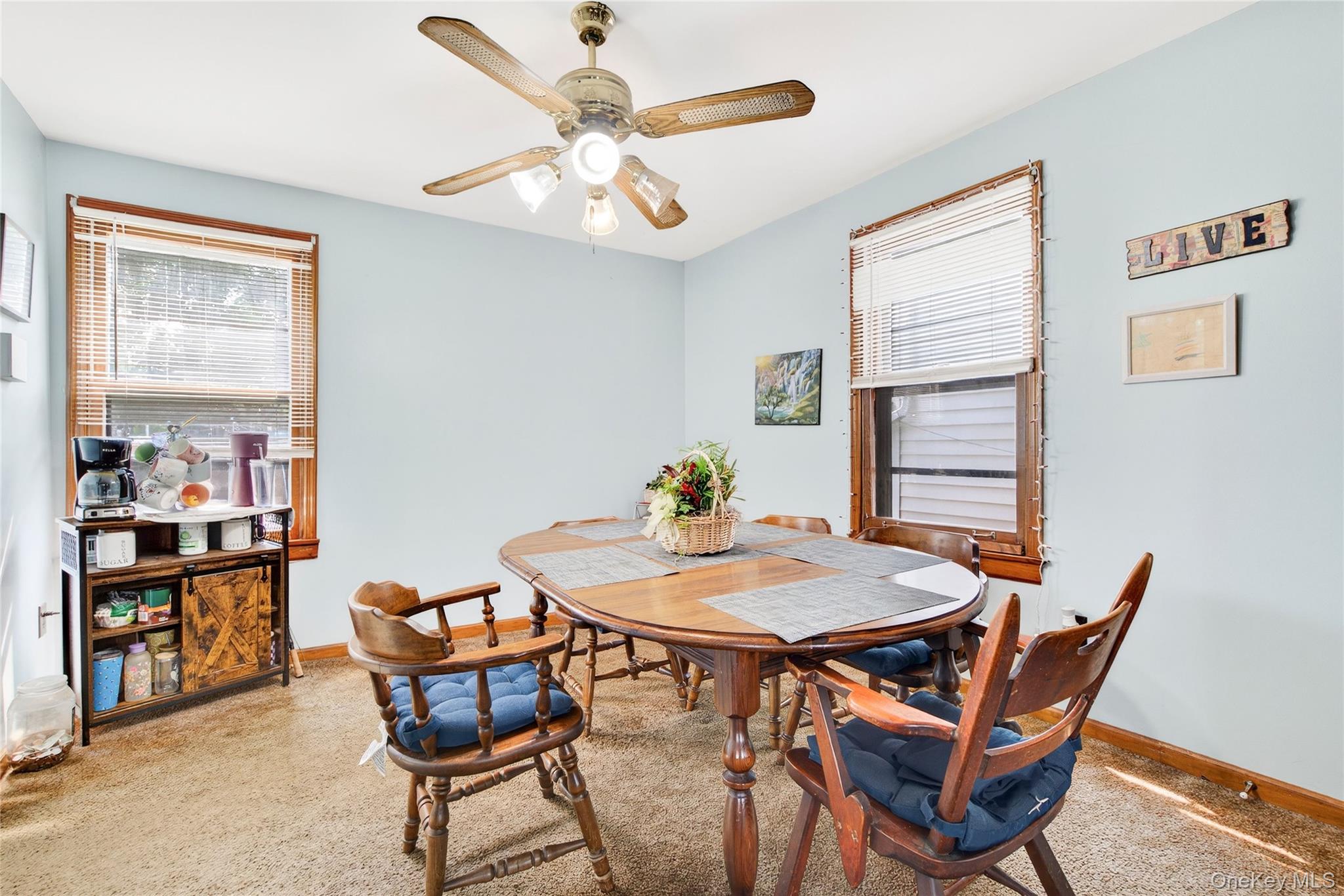 131 Front Street Port Jervis, NY 12771 - Photo 11 of 35 Dining room featuring light colored carpet, baseboards, and ceiling fan