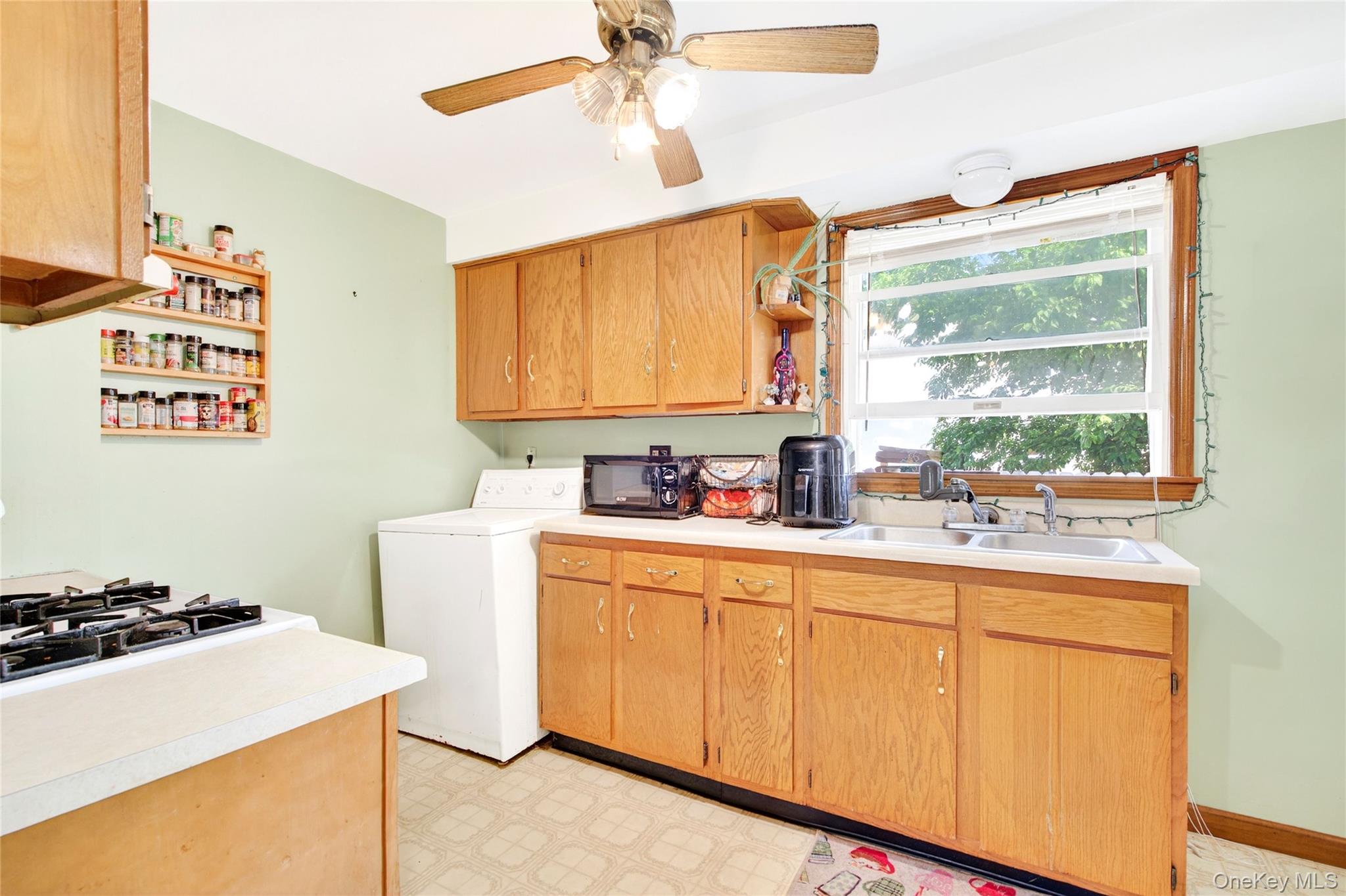 131 Front Street Port Jervis, NY 12771 - Photo 14 of 35 Washroom featuring washer / clothes dryer, light floors, and a ceiling fan