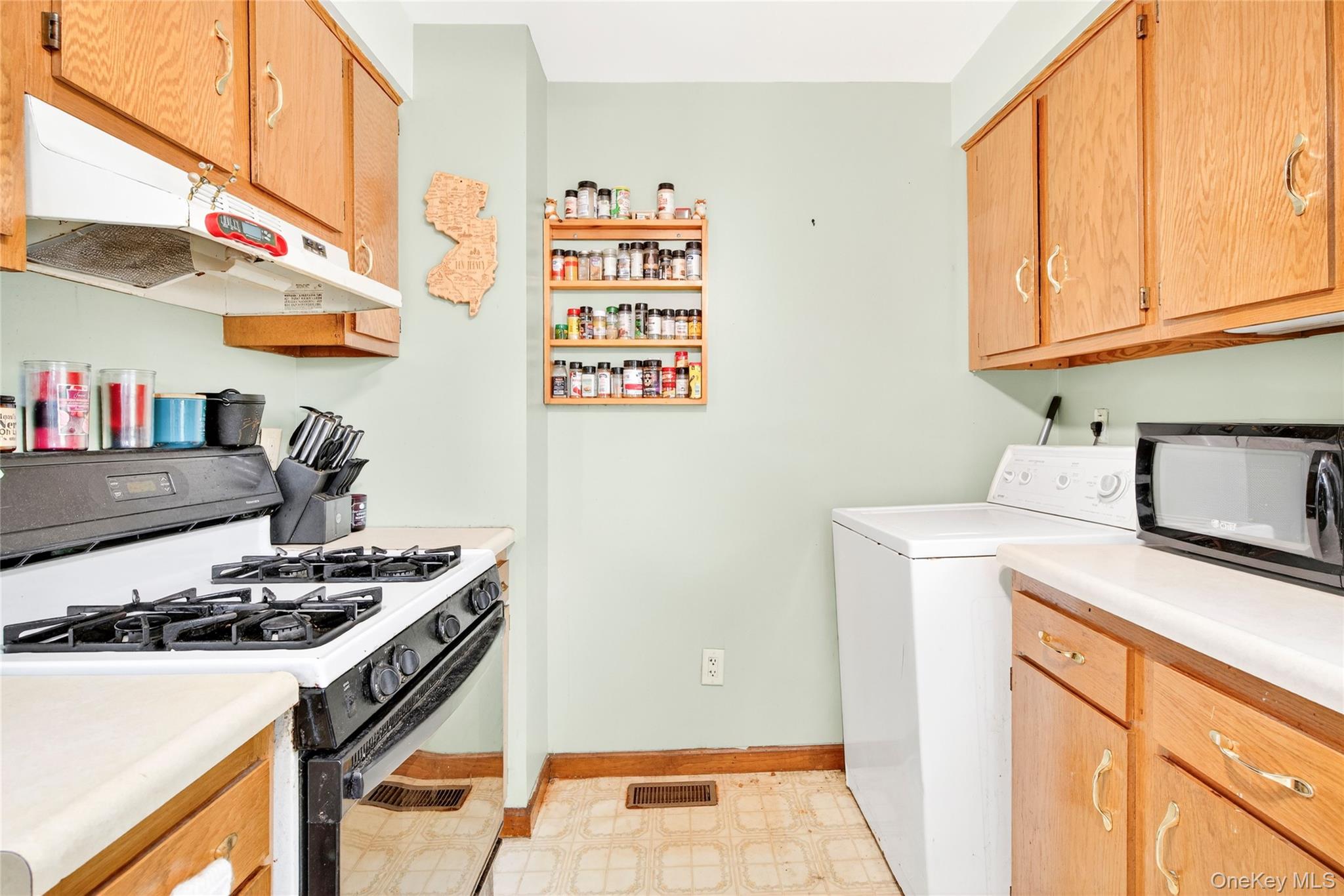 131 Front Street Port Jervis, NY 12771 - Photo 16 of 35 Washroom with washer / clothes dryer, light floors, and baseboards