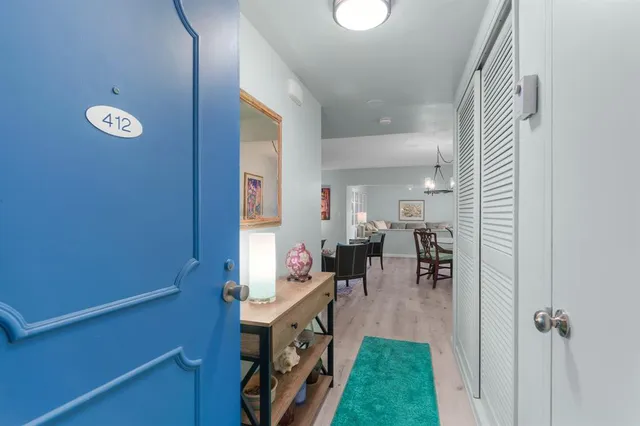 a view of living room with a table and chairs