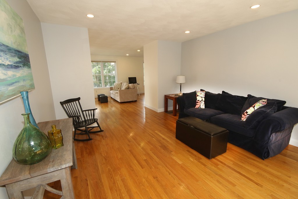5 Melvin Street, Unit B Wakefield, MA 01880 - Photo 11 of 28 a living room with furniture and a wooden floor