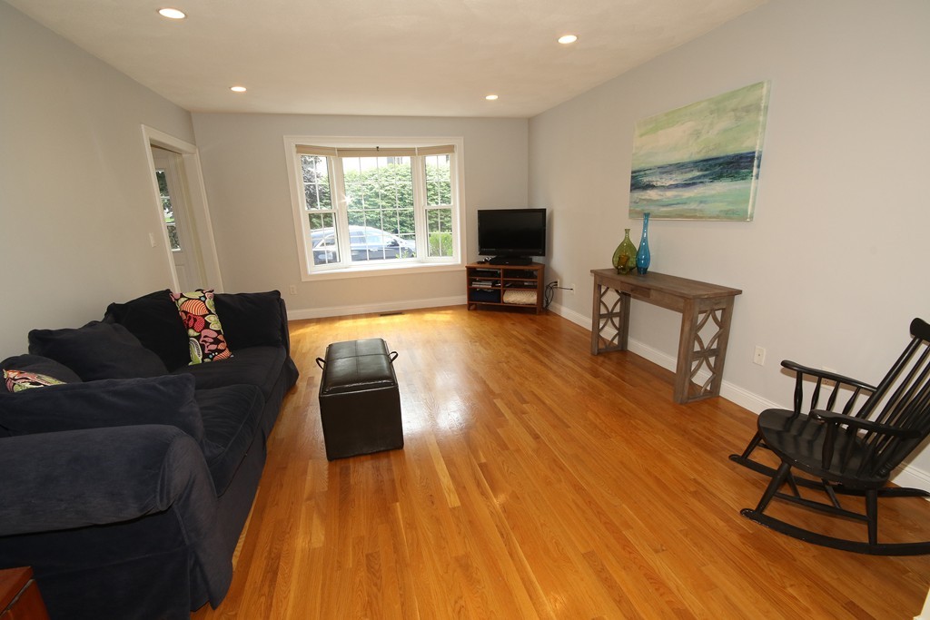 5 Melvin Street, Unit B Wakefield, MA 01880 - Photo 12 of 28 a living room with furniture and a flat screen tv